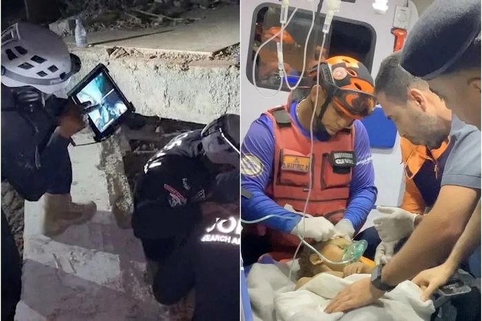 Bé trai được đưa ra khỏi đống đổ nát (Ảnh: Reuters).