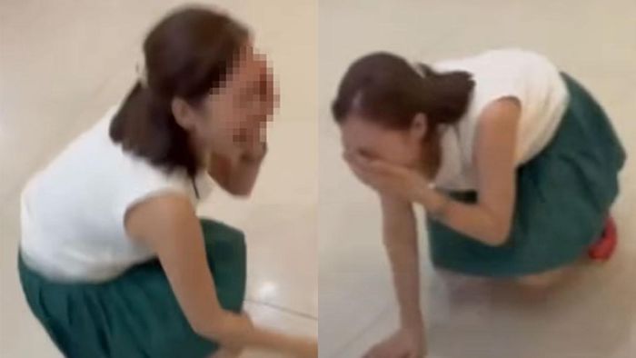 Người phụ nữ ngồi sụp xuống, la hét, kêu mình bị đánh khi tranh cãi với tài xế. Ảnh cắt từ clip