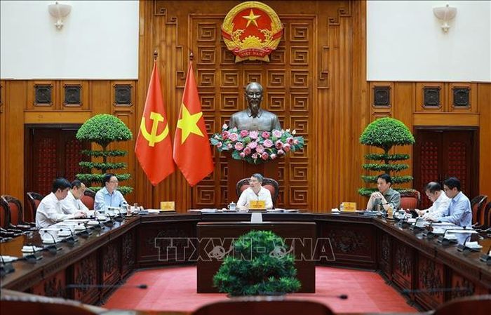 Thủ tướng Lê Minh Hưng chủ trì làm việc với lãnh đạo Bộ Công an và Bộ Khoa học và Công nghệ về xây dựng khung kiến trúc tổng thể quốc gia số. Ảnh: Dương Giang/TTXVN
