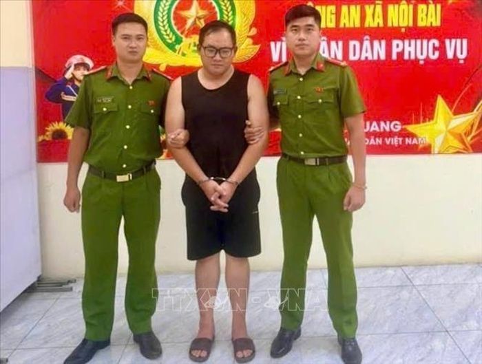Đối tượng Nguyễn Tiến Dũng tại cơ quan Công an. Ảnh: TTXVN phát