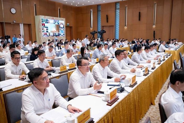 Các đại biểu tham dự hội nghị tại điểm cầu trụ sở Chính phủ sáng 4-7. Ảnh: quochoi.vn