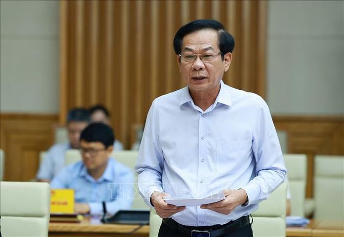 Bộ trưởng Bộ Nội vụ Đỗ Thanh Bình, Phó Chủ tịch Thường trực Hội đồng Thi đua - Khen thưởng Trung ương báo cáo sơ kết công tác thi đua, khen thưởng. Ảnh: Dương Giang/TTXVN