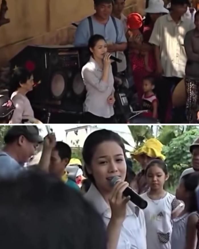Hình ảnh Nhật Kim Anh hát ở lề đường bán kẹo kéo. Nguồn: Ảnh chụp màn hình.