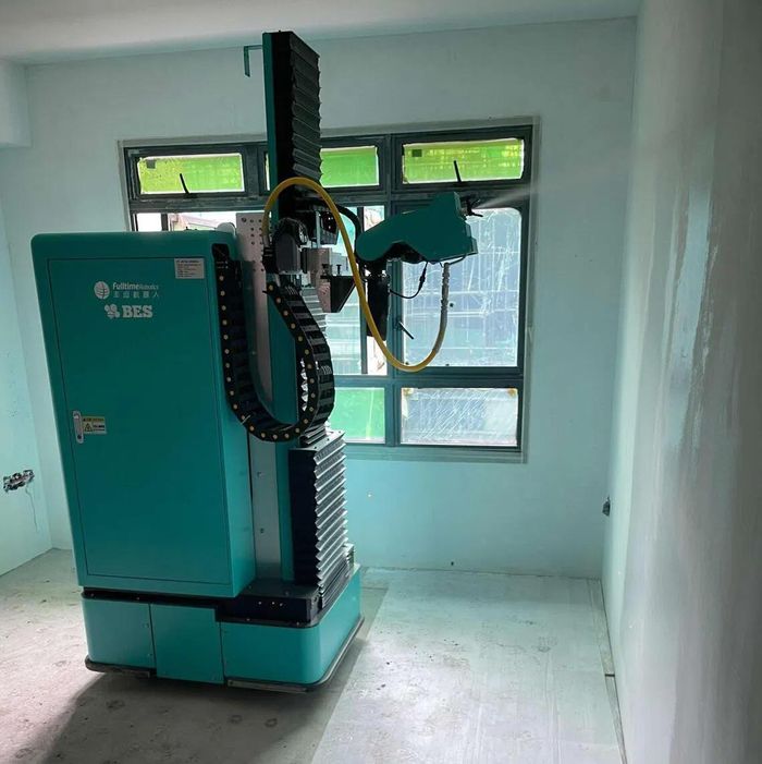 Robot sơn tường hoạt động tại Singapore. Ảnh: Cục Phát triển nhà ở Singapore