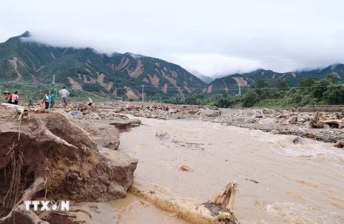 Hiện trường tan hoang sau khi cơn lũ đi qua tại xã Mường Than, tỉnh Lai Châu. (Ảnh: Quý Trung/TTXVN)