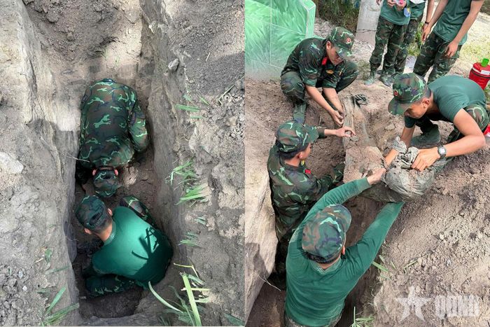 Cán bộ, chiến sĩ Đội K71 đưa hài cốt liệt sĩ lên mặt đất để tiến hành các bước tiếp theo đúng quy định.