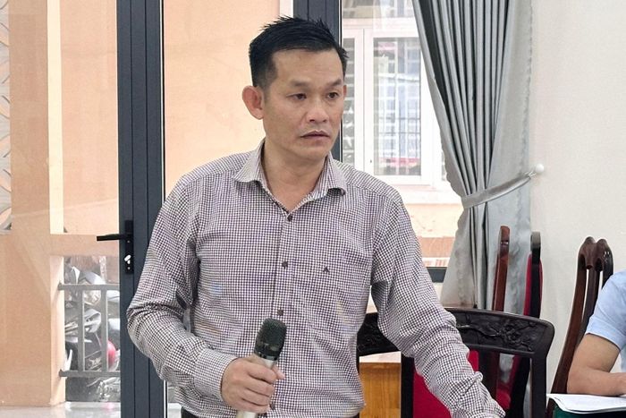 Đồng chí Võ Văn Nam, Bí thư Đảng ủy, Chủ tịch HĐND xã báo cáo kết quả thực hiện các nhiệm vụ trọng tâm trong 6 tháng đầu năm
