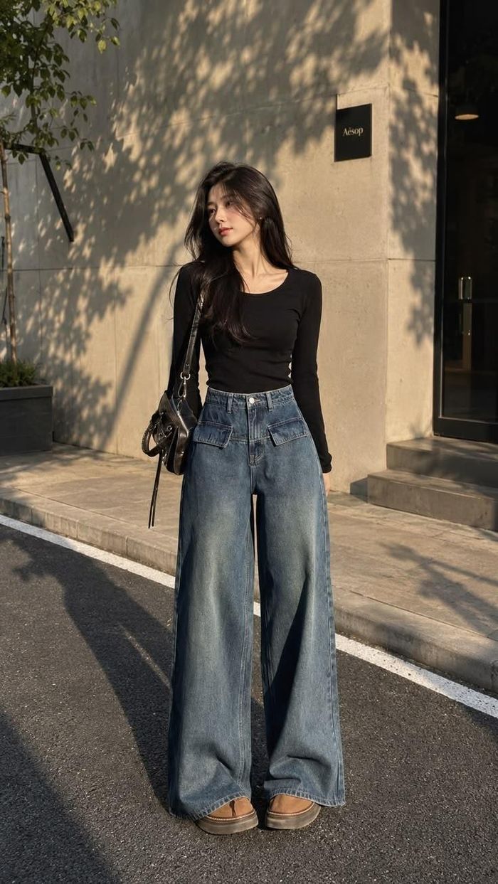 Sơ vin cùng quần jeans cạp cao giúp tôn dáng hiệu quả. (Ảnh: Minh họa)