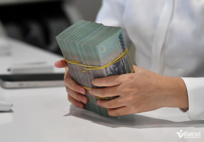 Sau 5 năm làm việc, người lao động nhận 900 triệu đồng theo thỏa thuận với doanh nghiệp. Ảnh minh họa: Nam Khánh