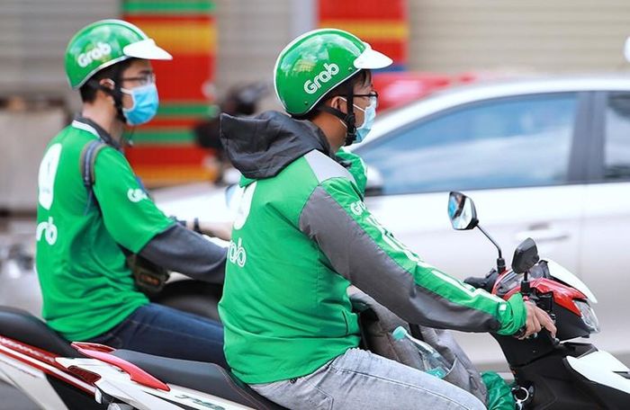Nhiều lái xe công nghệ mong muốn được tham gia bảo hiểm xã hội. Ảnh: Tạ Hải