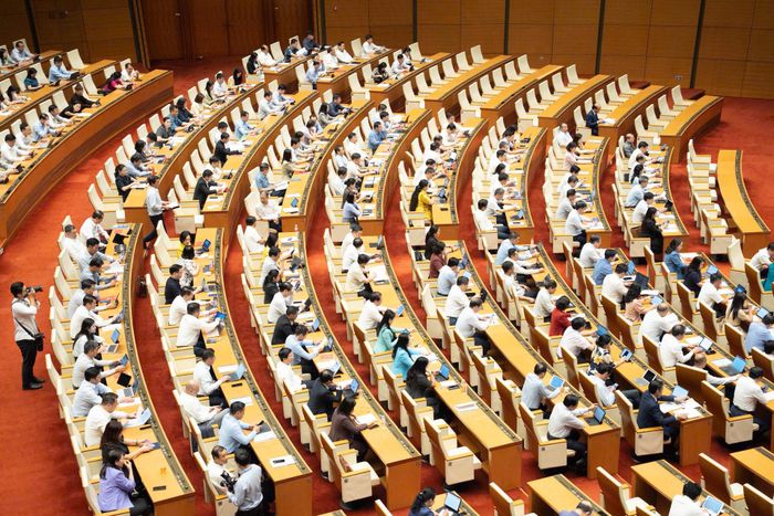 Quốc hội nghe trình bày các tờ trình, báo cáo về các dự án nghị quyết của Quốc hội. Ảnh: QH