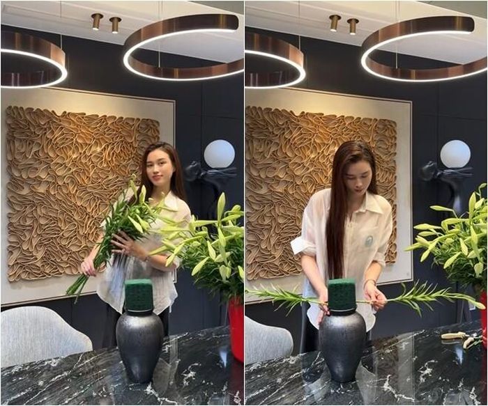 Sau khi hoàn thiện phần khung, nàng hậu liên tục quan sát từ nhiều góc khác nhau để điều chỉnh khoảng cách giữa các cành hoa. Khi những nụ hoa lần lượt bung nở, cả bình hoa trở thành điểm nhấn nổi bật trong không gian nội thất hiện đại của căn hộ.