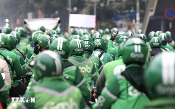 Ủy ban Cạnh tranh Quốc gia vừa xử phạt Grab hơn 1,3 tỷ đồng về vi phạm trong lĩnh vực bảo vệ quyền lợi người tiêu dùng (Ảnh: TTXVN)