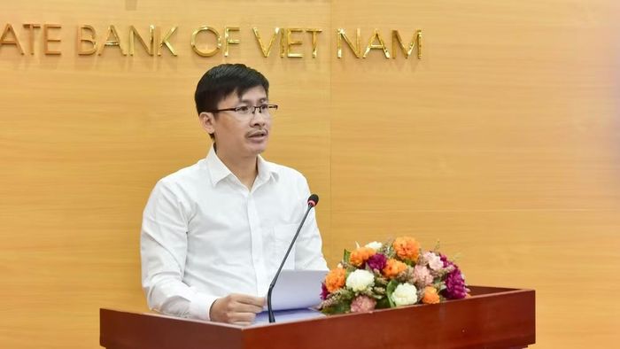 Ông Hoàng Minh Tiến - Phó Cục trưởng Cục Công nghệ thông tin (Ngân hàng Nhà nước) phát biểu tại cuộc họp báo. (Ảnh: Huyền Anh)
