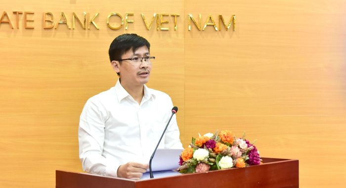 Ông Hoàng Minh Tiến, Phó Cục trưởng Cục Công nghệ thông tin NHNN phát biểu. Ảnh: LƯU THỦY