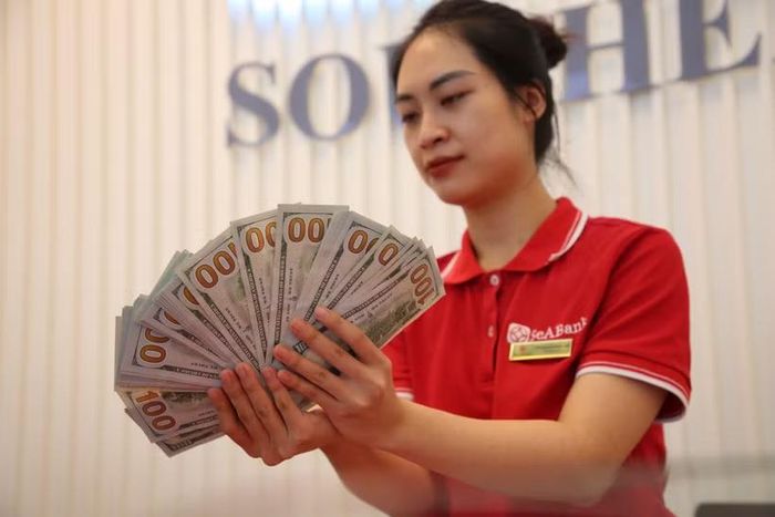 Giá vàng tăng 500.000 đồng, tỷ giá giảm tới 60 đồng phiên chiều nay. (Ảnh: Vietnam+)