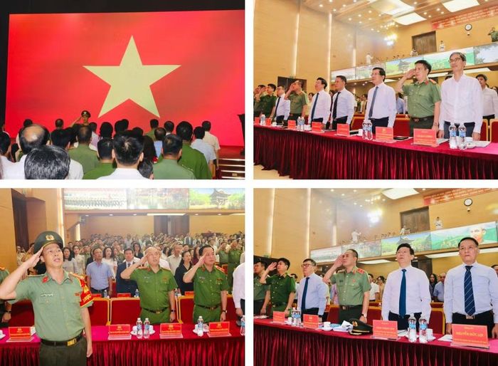 Các đại biểu, khách mời trang nghiêm trong nghi thức chào cờ tại lễ kỷ niệm