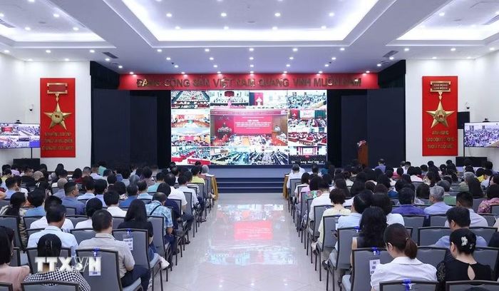 Đảng viên thuộc Đảng bộ Thông tấn xã Việt Nam tham dự Hội nghị trực tuyến tại điểm cầu trụ sở Thông tấn quốc gia (số 5 Lý Thường Kiệt, Hà Nội). (Ảnh: Văn Điệp/TTXVN)