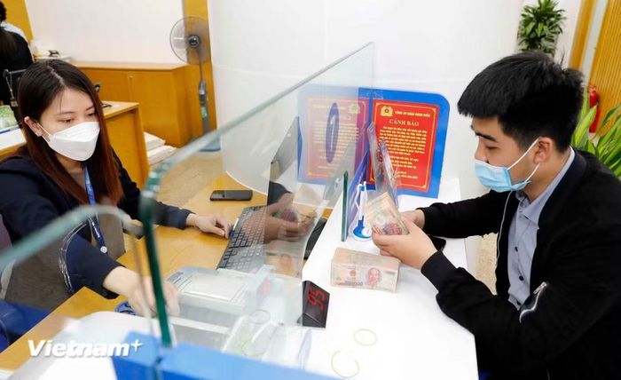 Trong 6 tháng đầu năm 2026, toàn hệ thống ngân hàng xử lý được 141.400 tỷ đồng nợ xấu, giảm 17,5% so với cùng kỳ năm trước. (Ảnh: Vietnam+)