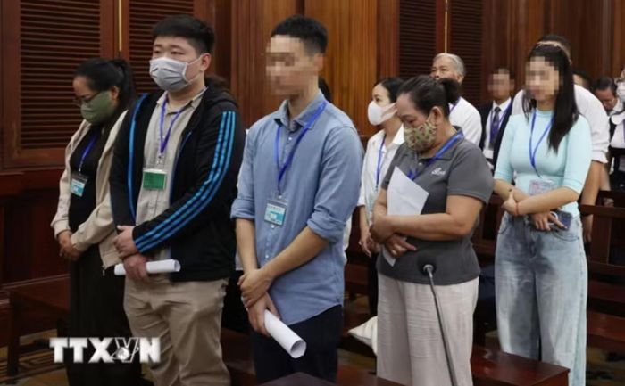 Các bị cáo thuộc nhóm đầu vụ tại phiên tòa ngày 17-8. Ảnh: TTXVN
