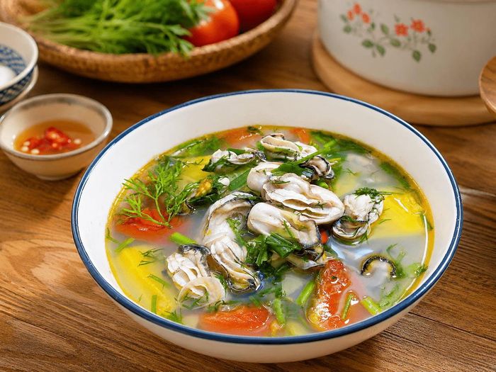 Món canh hàu chua ngọt thơm lừng, đậm đà. Ảnh minh họa AI