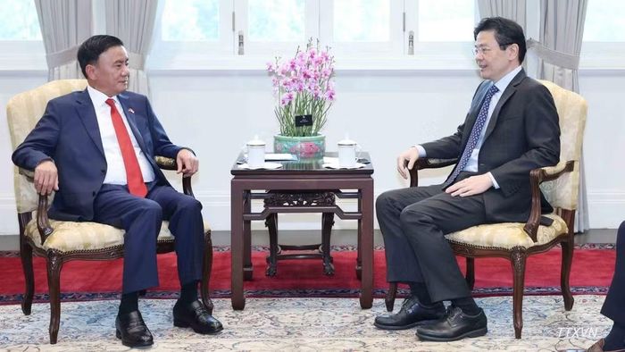 Thường trực Ban Bí thư Trần Cẩm Tú hội kiến Tổng Thư ký Đảng Hành động Nhân dân, Thủ tướng Singapore Lawrence Wong. (Ảnh: TTXVN)