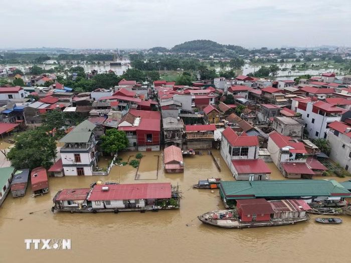 Nước sông dâng cao ngập nhà dân gần 2m. (Ảnh: Thanh Thương/TTXVN)