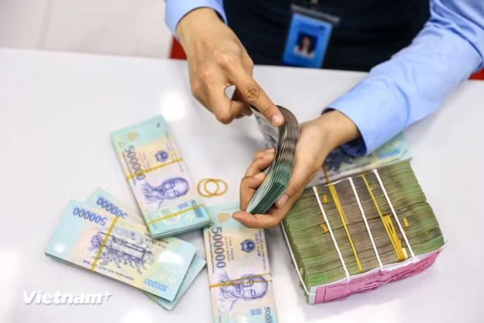 Tín dụng tăng nhanh, ngân hàng đối mặt áp lực nguồn vốn. (Ảnh: Vietnam+)