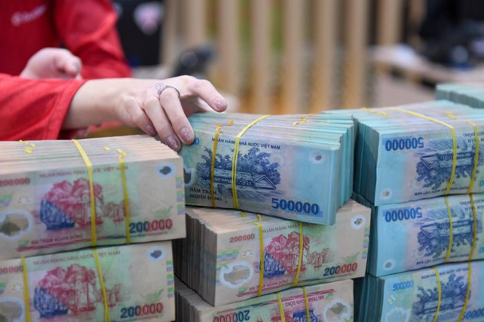 Chuyên gia cho rằng, áp lực lên các đồng tiền châu Á, trong đó có VND, sẽ không đến từ một cú sốc đơn lẻ. Ảnh: Hoàng Anh