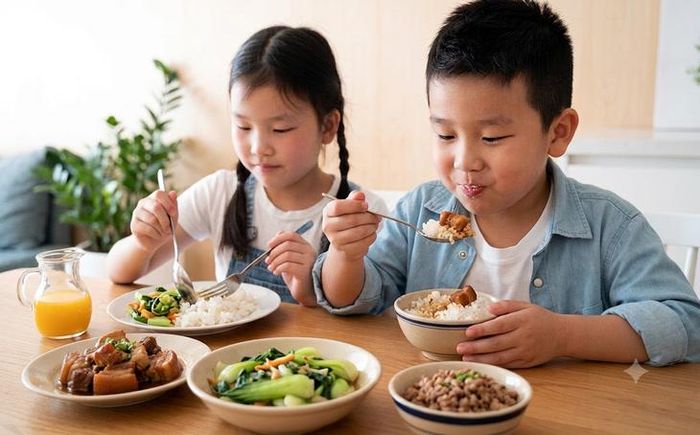 Cần bổ sung các dưỡng chất trong chế độ ăn hàng ngày giúp trẻ có sức khỏe tốt để chuẩn bị bước vào năm học mới. Ảnh minh họa AI