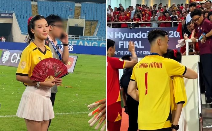 Khoảnh khắc tình tứ của Hoàng Oanh và Lê Giang Patrik trên sân Mỹ Đình.