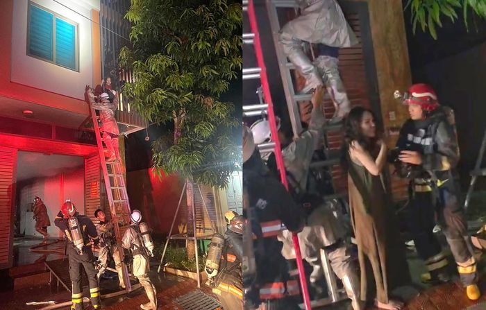 Sau nỗ lực, lực lượng chức năng đưa 2 người mắc kẹt ra bên ngoài tại vị trí an toàn.