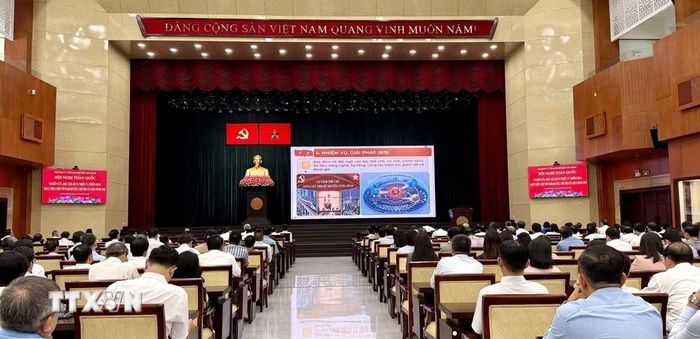 Các đại biểu tham dự hội nghị tại đầu cầu Hội trường Thành ủy Thành phố Hồ Chí Minh. (Ảnh: Mỹ Phương/TTXVN)