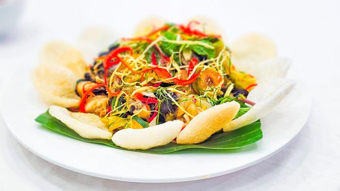 Món ốc nhồi trộn sả, tắc. Ảnh: Nguyên Hưng 