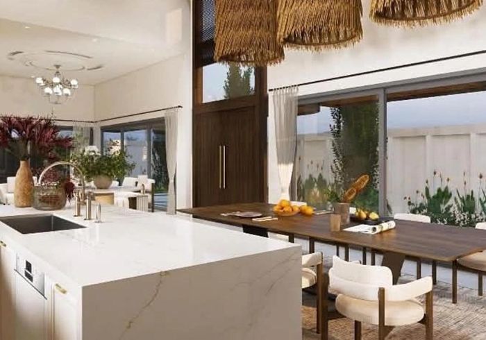 Khu vực bếp mở với các mảng kính lớn kết nối không gian.