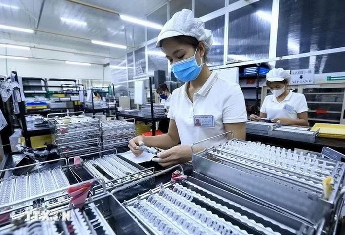 Công nhân làm việc tại một công ty có vốn FDI. (Ảnh: Tuấn Anh/TTXVN)