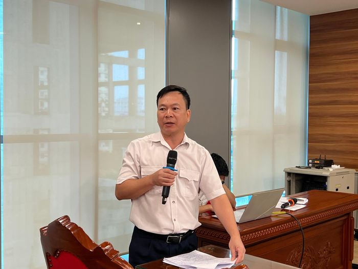 Ông Trần Minh - Trưởng phòng Kiểm toán đầu tư dự án trao đổi về những vướng mắc trong kiểm toán doanh nghiệp thi công xây dựng. Ảnh: Thanh Trang