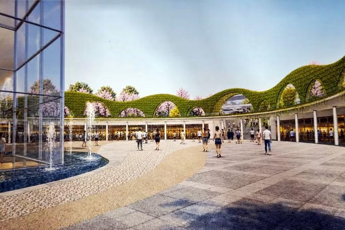 Không gian lòng chảo quảng trường thoáng đãng vào ban ngày, nơi các vòm cuốn xanh ôm trọn khoảng sân rộng phục vụ các hoạt động ngoài trời.