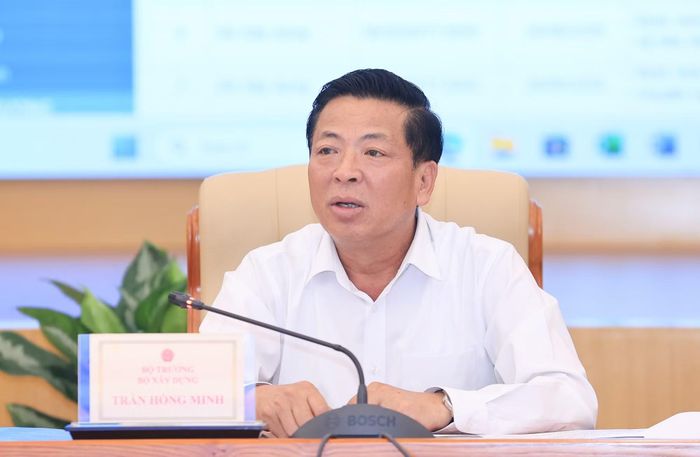 Bộ trưởng Bộ Xây dựng Trần Hồng Minh yêu cầu hoạt động nghiên cứu khoa học, công nghệ và đổi mới sáng tạo phải hướng tới sản phẩm cụ thể. (Ảnh: Tạ Hải/Vietnam+)