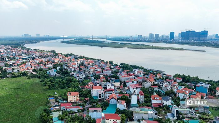 Phân đoạn này rộng khoảng 4.548ha, dân số khoảng 541.000 người. Trong ảnh là khu vực sông Hồng thuộc xã Vĩnh Thanh.