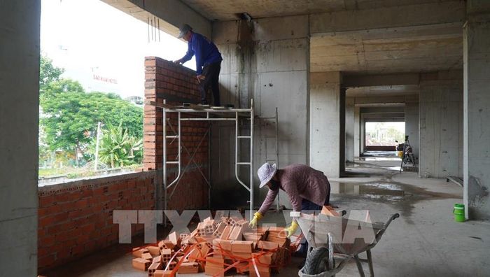 Khối chung cư A1 dự kiến hoàn thành vào cuối tháng 3/2027. Ảnh: Nhựt An - TTXVN
