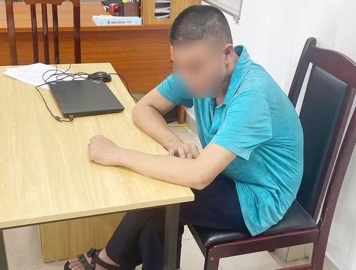 Ông Đ.Q.H tại trụ sở cơ quan công an