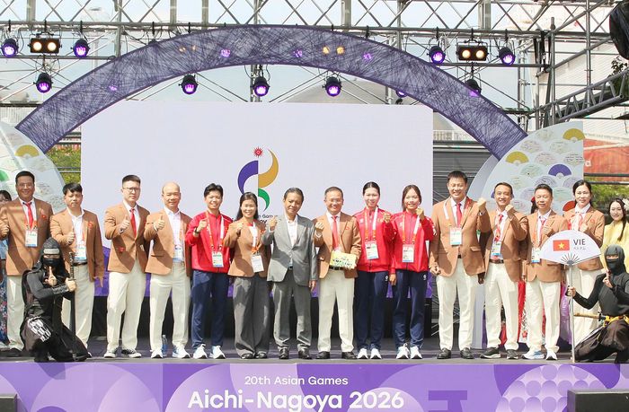  Các thành viên Đoàn thể thao Việt Nam thể hiện sự quyết tâm. Ảnh: QÚY LƯỢNG