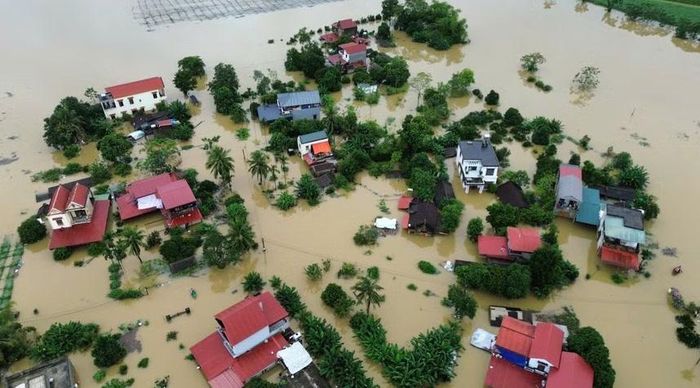 Nhà dân bị ngập do mưa lũ ở phường Hàm Rồng và các xã Kim Tân, Nông Cống, Hoạt Giang (Thanh Hóa). Ảnh: TTXVN