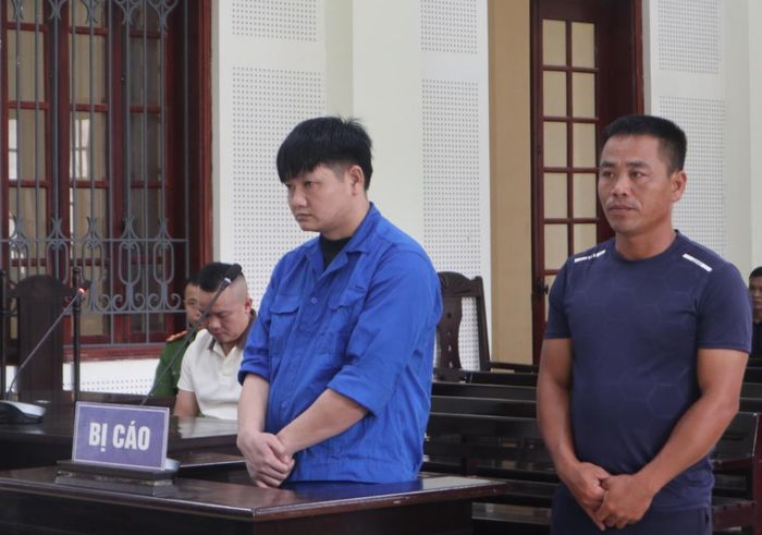 Hai bị cáo Hoàng Hữu Lương và Nguyễn Văn Đào tại phiên tòa.