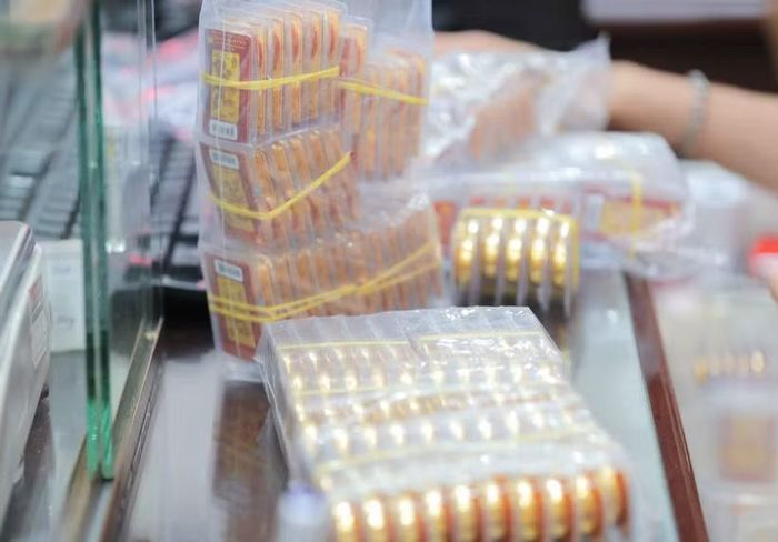 Giá vàng miếng SJC đi ngang, tỷ giá tại ngân hàng biến động nhẹ. (Ảnh: Vietnam+)