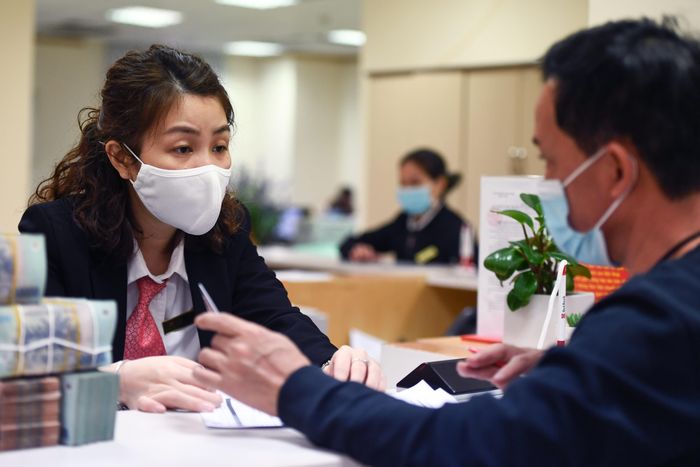 Ngoài lịch sử tín dụng, ngân hàng có thể sẽ đánh giá thêm tình trạng nộp thuế của người vay, sau khi ngành thuế chia sẻ dữ liệu cho CIC. Ảnh: Nam Khánh.
