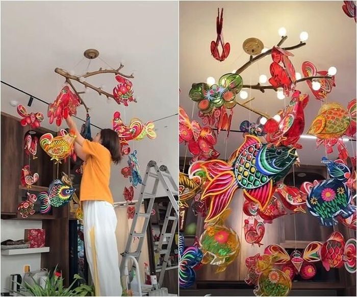 Vân Trang cẩn thận trèo lên thang để điều chỉnh vị trí từng chiếc đèn, tạo nên một "bầu trời" rực rỡ sắc màu ngay trong căn bếp.