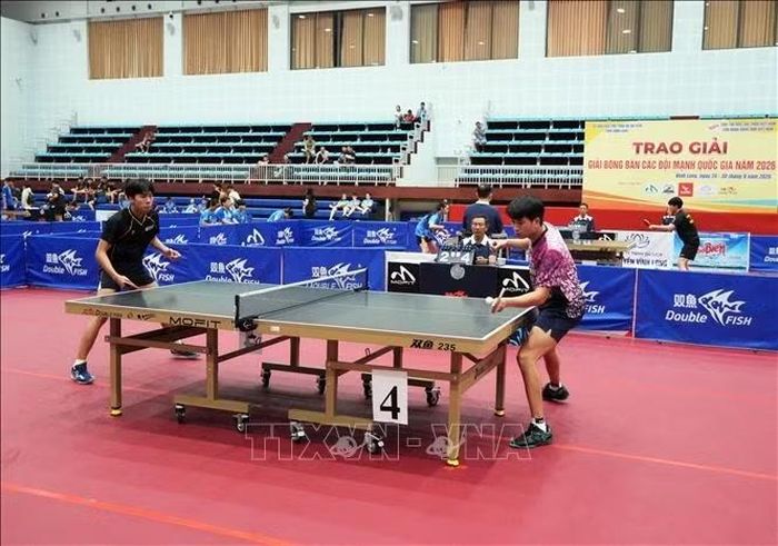 Trận đấu nội dung đồng đội nam giữa 2 đội Hà Nội và Hải Phòng. Ảnh: Phạm Minh Tuấn-TTXVN