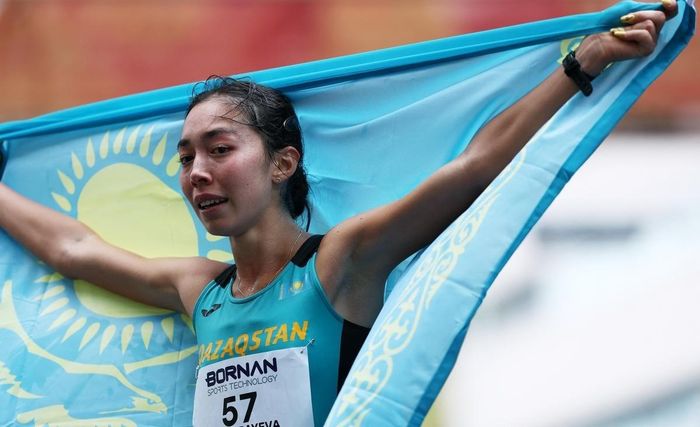 Toxanbayeva hoàn thành cự ly 42,195 km với thời gian 3 giờ 22 phút 20 giây. Ảnh: Chalinee Thirasupa/Reuters.